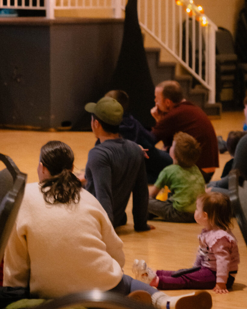 Photograph of a captivated crowd watching the stage at Nanaimo Beban Park during the community Maple Sugar Festival.