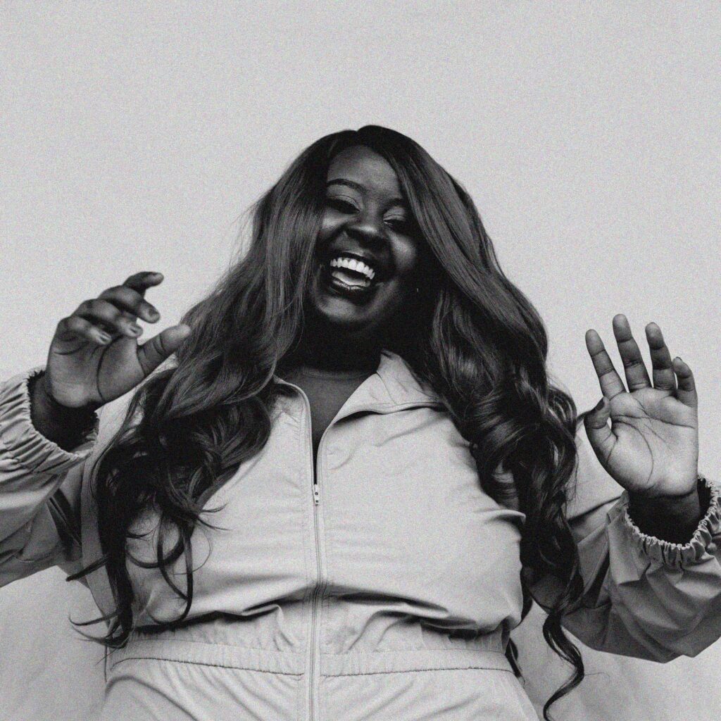 Missy D, joyful black-and-white portrait.