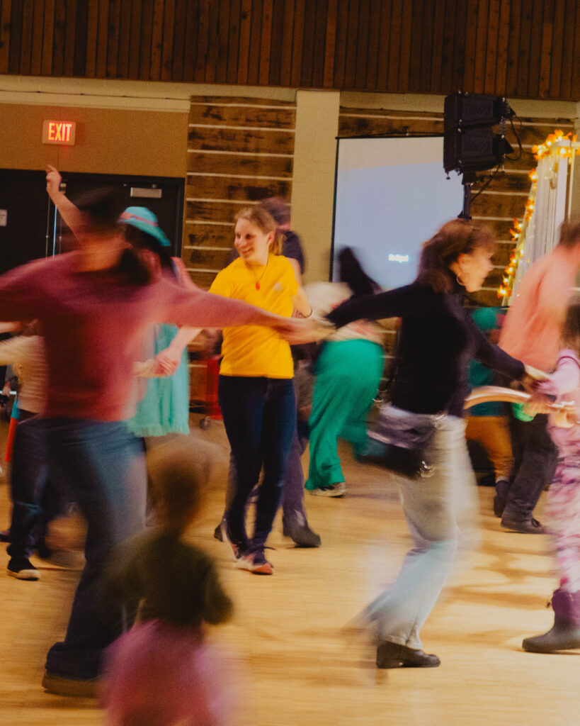 Crowd are dancing, vibrating, during Maple Sugar Festival.